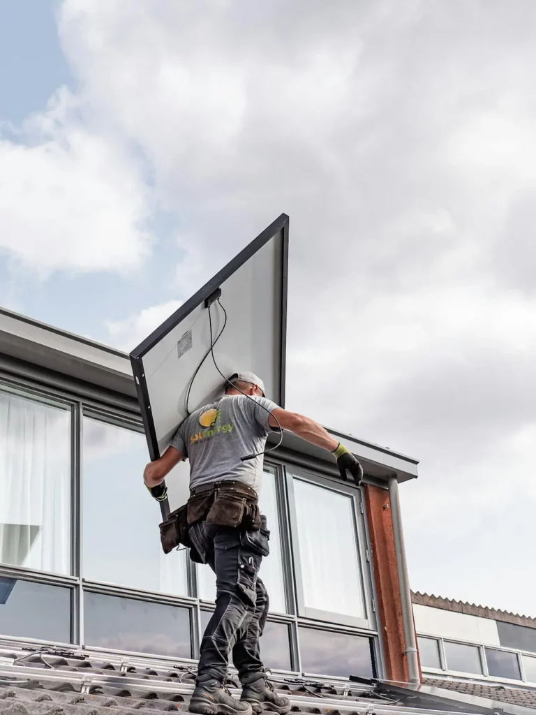 person removing a solar panel