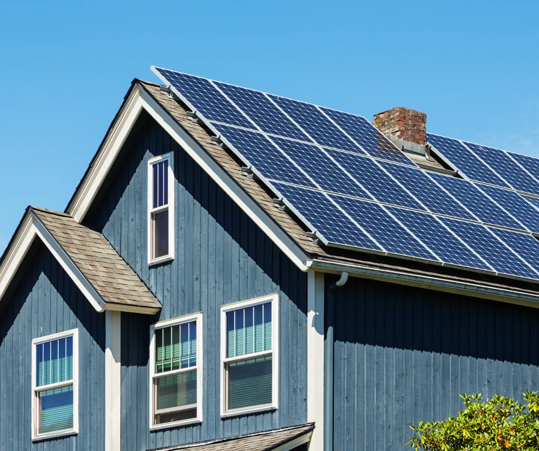 small town American house with solar panels on the roof